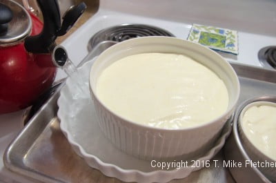 Pouring water into water bath for the Lemon Raspberry Pudding Cake