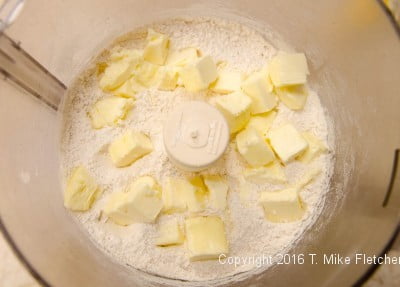 Butter over flour for the Kifle with Walnut Filling