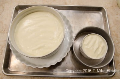 Filled containers on a tray for the Lemon Raspberry Pudding Cake