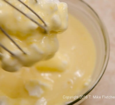 Whisking egg whites into batter for the Lemon Raspberry Pudding Cake