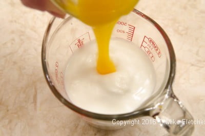 Yolks added to milk for the Lemon Raspberry Pudding Cake