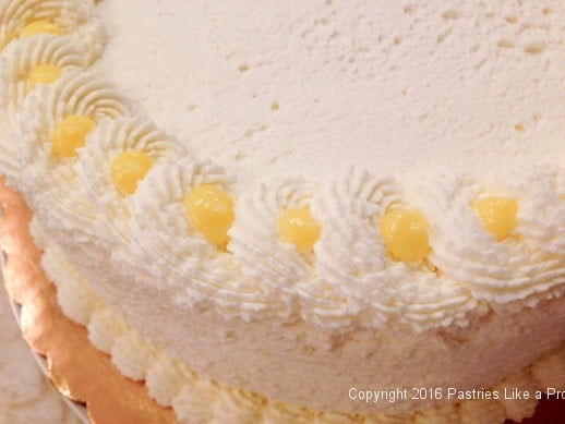 lemon-curd-in-whipped-cream-edging-for-the-lemon-blueberry-cake.jpeg