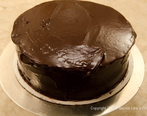 Ganache overhanging top edge of cake for Why, When and How to undercoat a cake