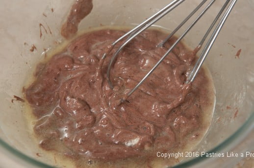 Whisking batter and butter for the Chocolate Raspberry Gateau