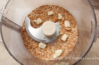 Butter in processor for the Roasted Peaches with Amaretti Crisp