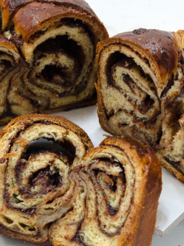 A slice of Babka swirled with a chocolate nutella filling.