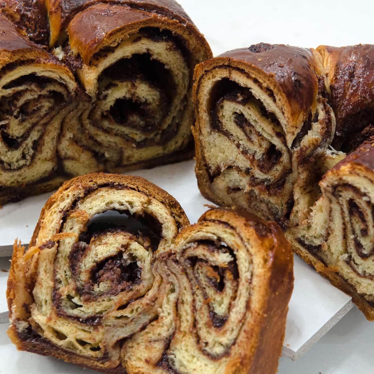 A slice of Babka swirled with a chocolate nutella filling.