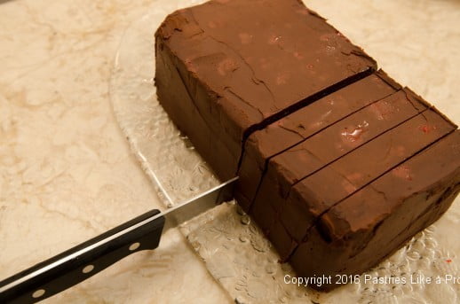 Slicing the Chocolate Raspberry Gateau Cake