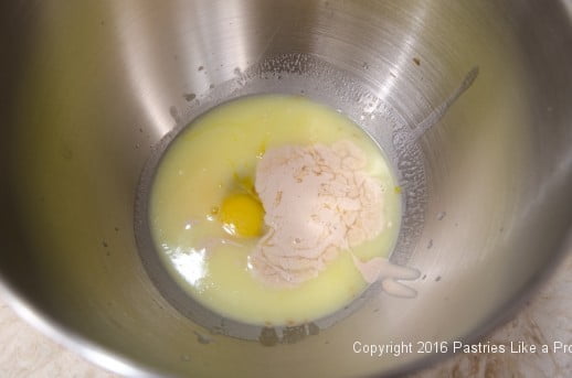 Eggs, yeast milk in bowl for the Chocolate Babka