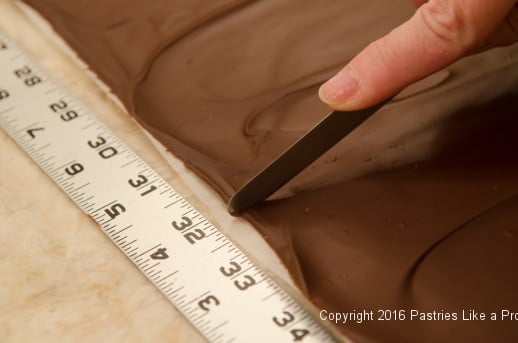 Measuring chocolate for panels for the Chocolate Raspberry Gateau