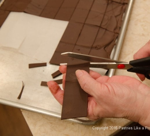 Trimming chocolate panels for the Chocolate Raspberry Gateau