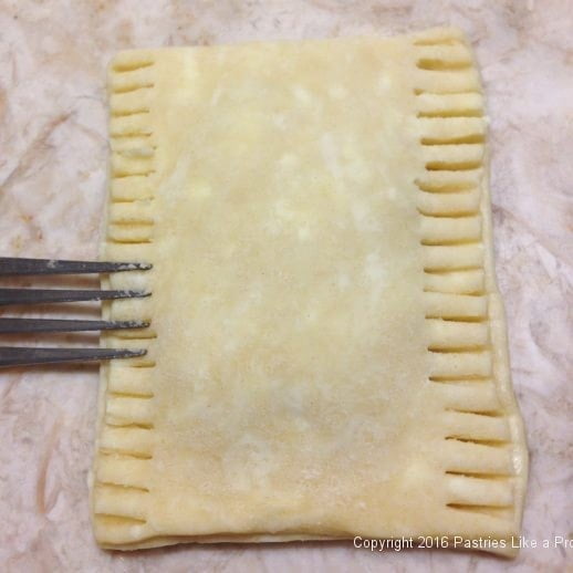 Sealing with a fork for Chocolate Raspberry Pop Tarts