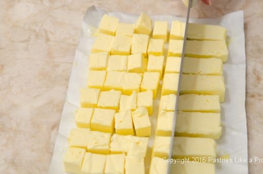 Cross cut butter into ¾ inch pieces for Kouign Amann