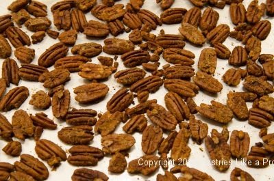 Hot Peppered Pecans baked on he pan.