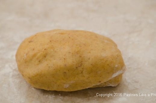 Rolling shortbread for Cheddar Pecan Shortbread