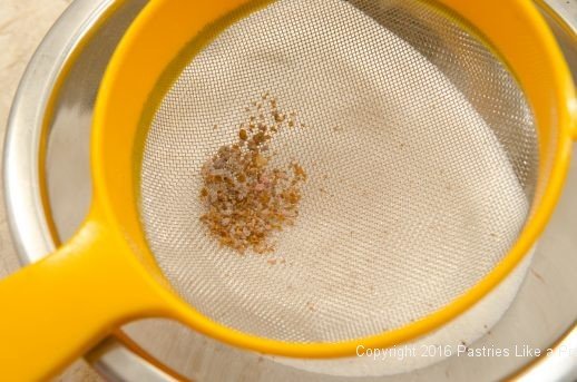 Straining the sugar for the Honey Diamonds