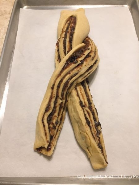 Twisting dough for the Brandied Chocolate Cherry Almond Filling