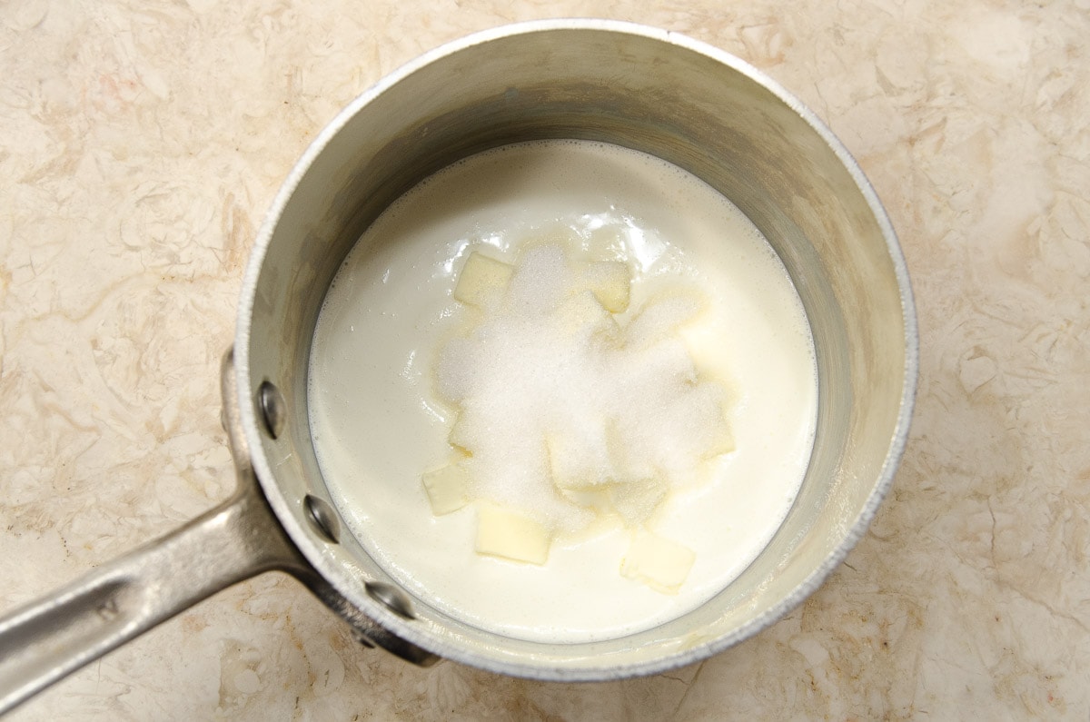 The cream, sugar and butter are placed in a sauce pan to be heated.