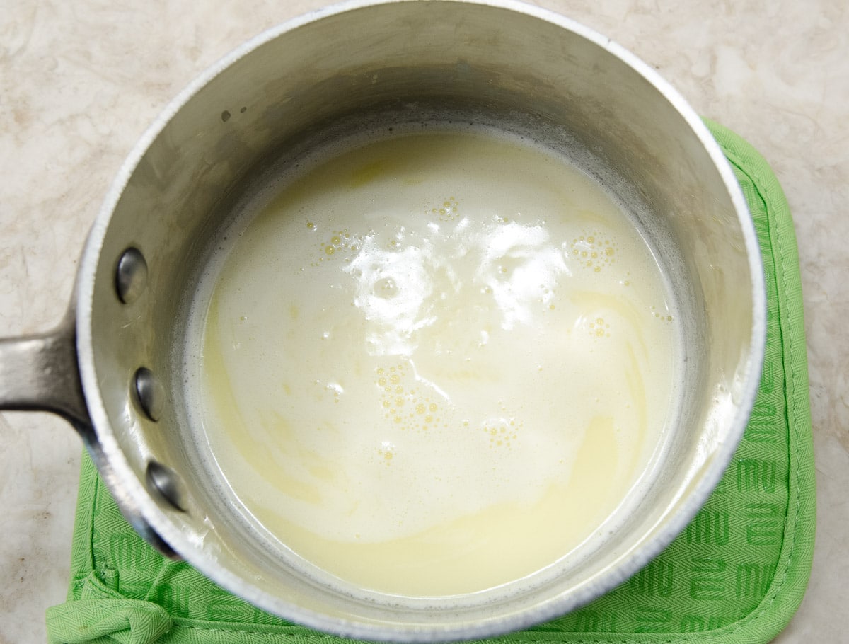 The cream, sugar and butter have been heated until steaming but not boiling.