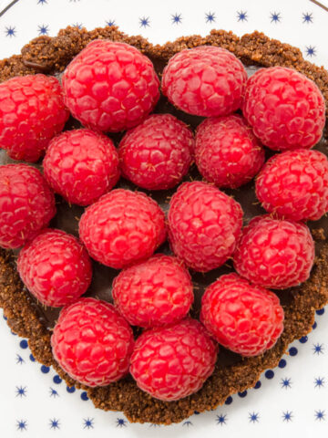 The truffle filled shell is topped with fresh raspberries just before serving.