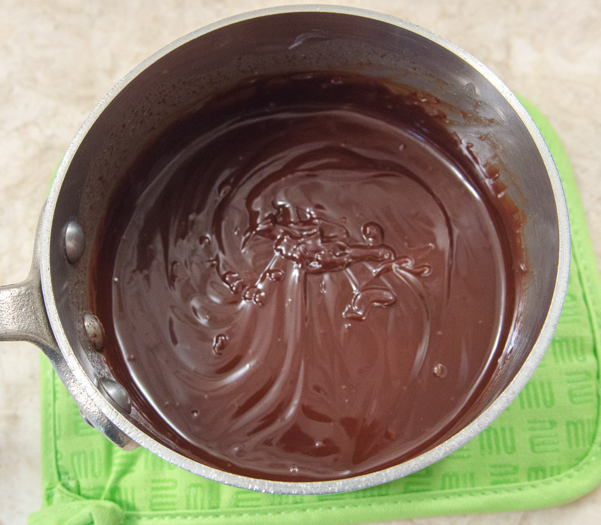 The dark chocolate truffle filling is smooth and ready to fill the tart shells.