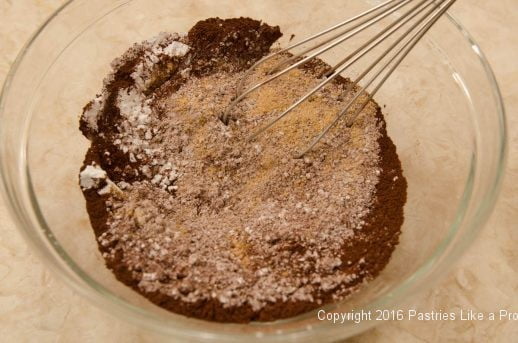 Whisking crust ingredients for the Chocolate Raspberry Truffle Tarts