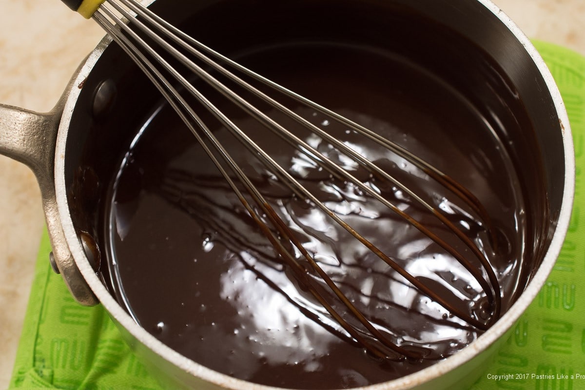 Chocolate and butter whisked for Decadent Gluten Free Turtle Cake