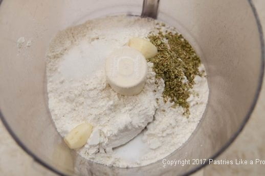 Ingredients in the processor for Garlic Oregano Cracker Bread
