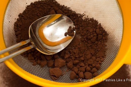 Sifting cocoa for Cocoa Fundamentlas Natural vs. Dutched
