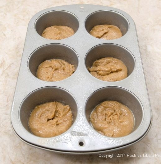 First layer of batter in bottom of pan for the Easy PBJ Muffins - an Anytime Treat