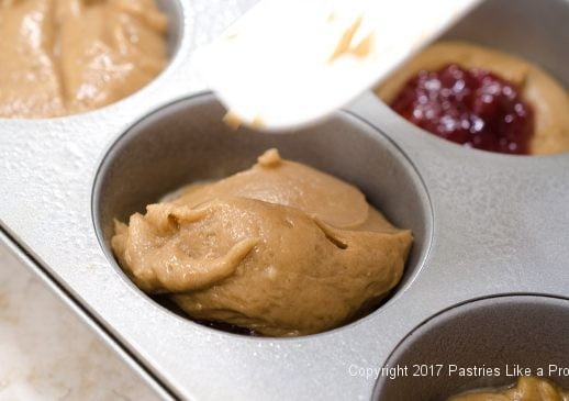 Top layer of batter on for the Easy PBJ Muffins - An Anytime Treat