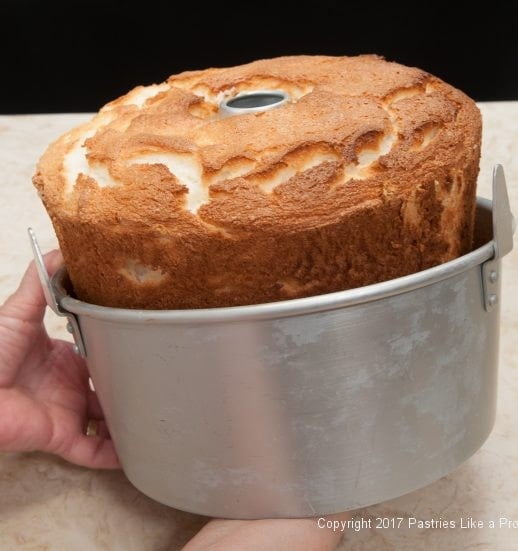 Removing side of pan for Angel Food Cake with Roasted Strawberries