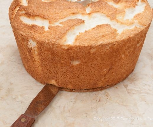 Releasing the bottom of the cake for Angel Food Cake with Roasted Strawberries