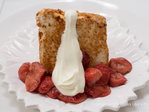 Cream on cake for Toasted Angel Food Cake with Roasted Strawberries