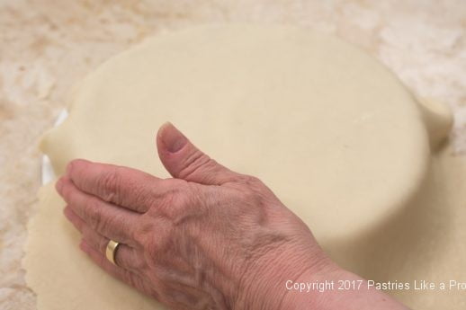 Pressing the marizipan onto the sides of the Chocolate Raspberry Marzipan Gateau