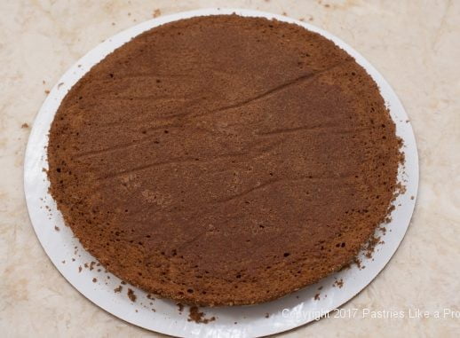 Paper removed from cake layer for the Chocolate Raspberry Marzipan Gateau