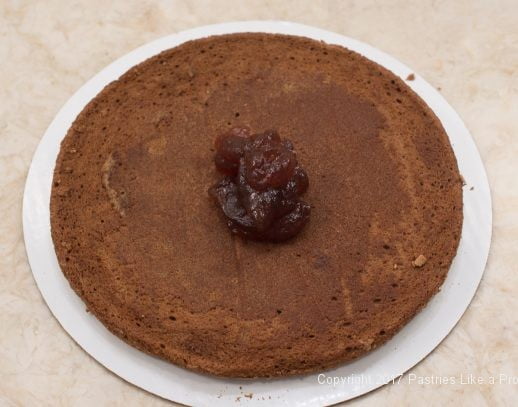 Raspberry jam on cake layer for the Chocolate Raspberry Marzipan gateau