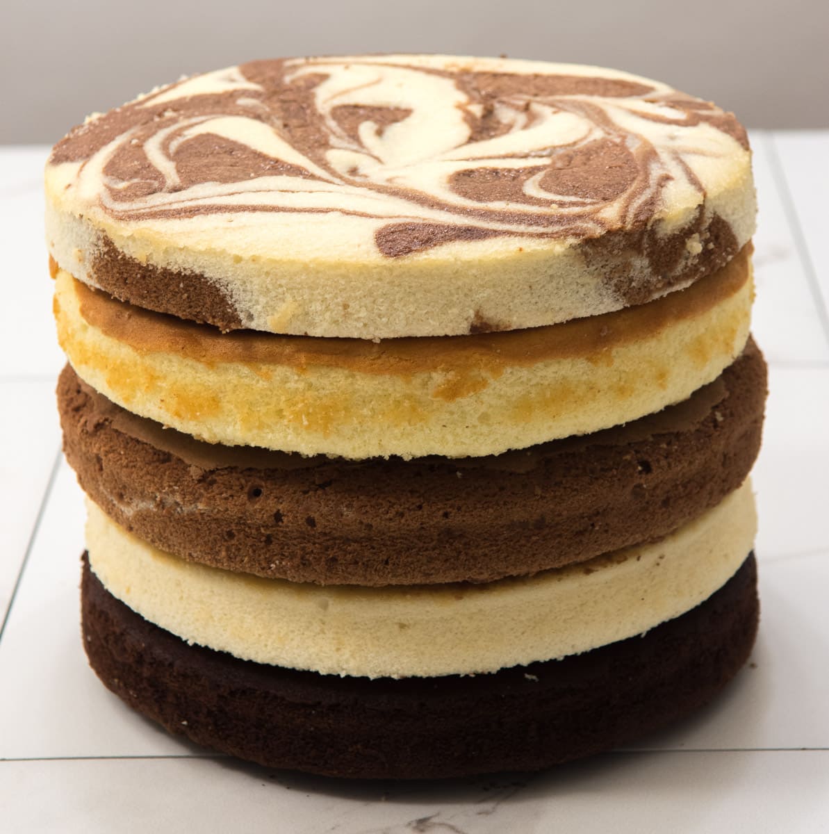 Five different layers of cake stacked upon each other