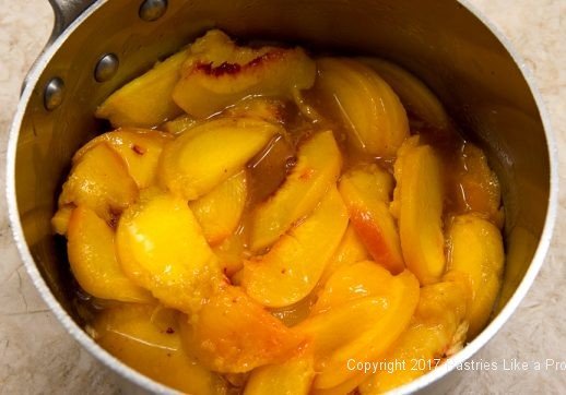 Peaches added to the pan for the White Wine Peach Sauce