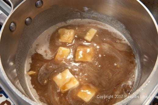 Ingredients melting in pan for the Praline Squares or Pecan Candy