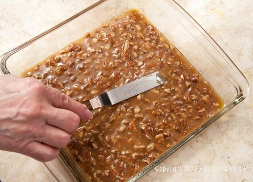 Spreading in pan for the Praline Squares or Pecan Candy