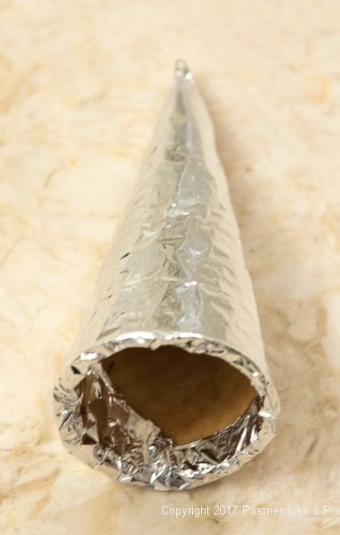 Top edges of foil tucked inside cone for chocolate Marshmallow Cream Horns
