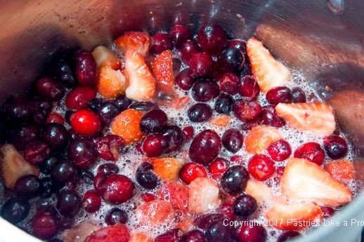 Fruit boiling for Scones with Cranberry Strawberry Jam