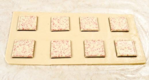 Peppermint patties placed on dough for the Peppermint Ravioli Cookies