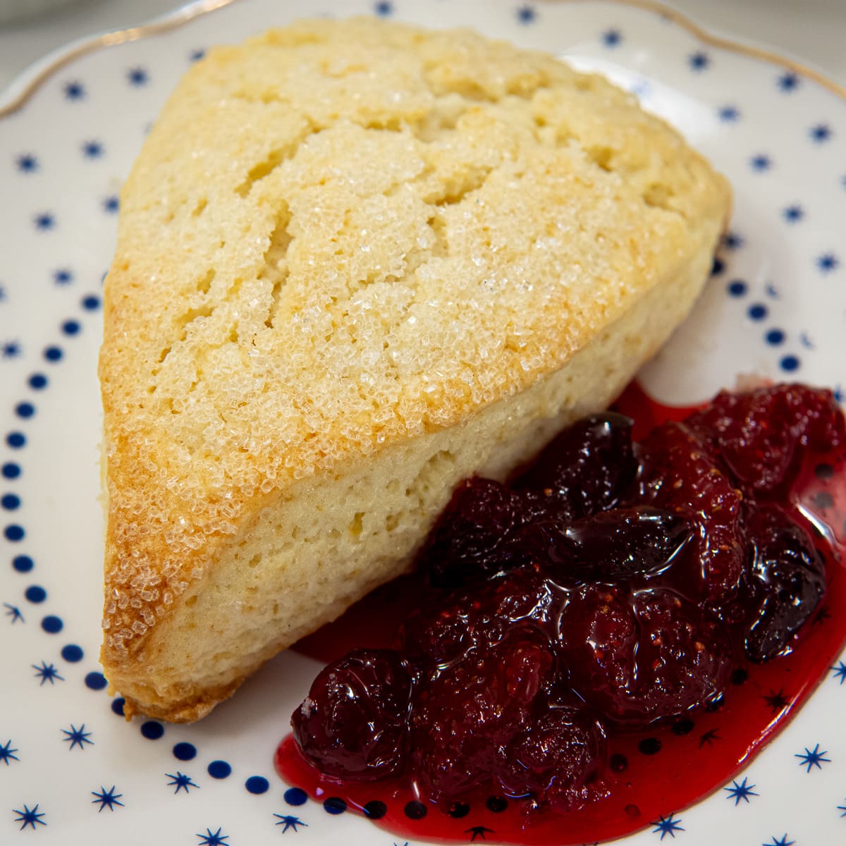 Scone with Cranberry Strawberry Jam on a plate