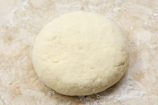 Dough shaped into a round for Scones with Cranberry Strawberry Jam