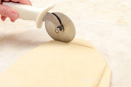 Trimming excess dough for the Peppermint Ravioli Cookies