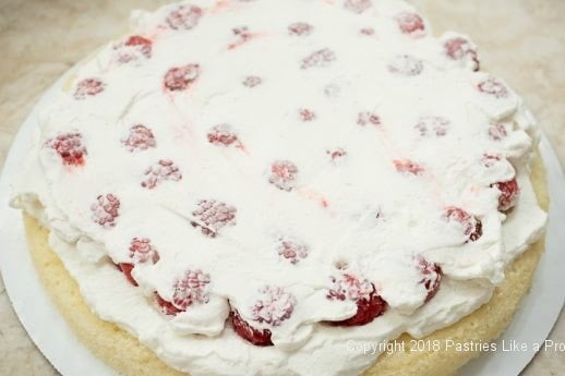 First layer with top cream for Raspberries and Cream Cake