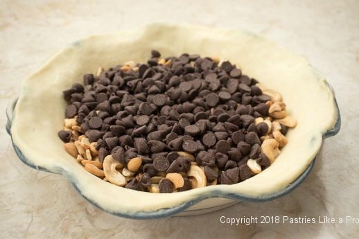 Nuts and Chips in crust fot Chocolate Cashew Derby Pie