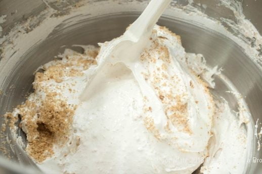 Folding nuts into meringue for Hazelnut Meringue with Raspberry Mascarpone Mousse